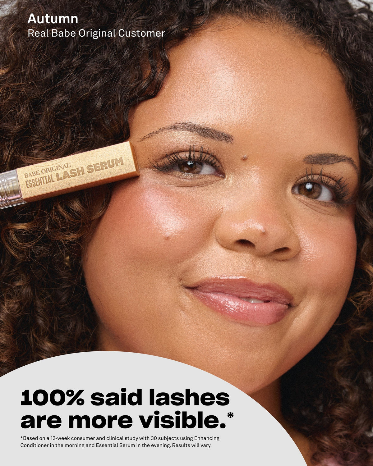 Customer holding Essential Lash Serum near her lashes