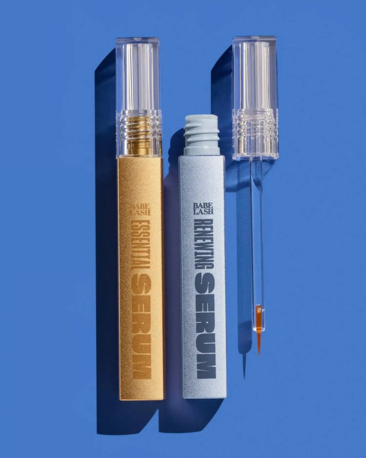 Essential Lash Serum and Renewing Lash Serum on a blue background