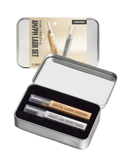 AM/PM Lash Set holiday tin open showing full-size Essential Lash Serum and Enhancing Lash Conditioner