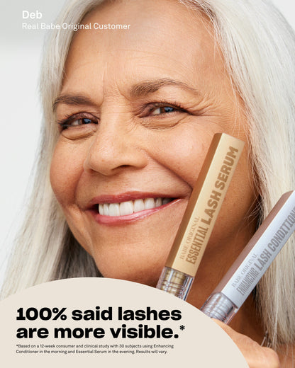 Customer holding Essential Lash Serum next to her lashes