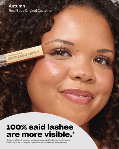 Customer holding Essential Lash Serum near her lashes